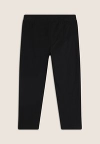 Leggings neri realizzati in tessuto elastico, con una ampia vita elasticizzata e una texture liscia, dalla silhouette aderente e senza cuciture visibili.
