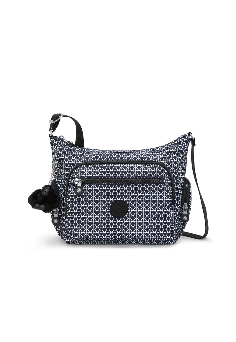 Marinblå og hvid mønstret crossbody taske med en tekstureret overflade, lynlåslommer, en aftagelig pom-pom charm og justerbar rem.