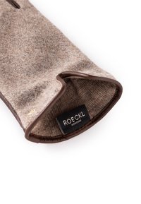Brown felt glove with a soft texture, featuring a brown leather trim and a visible label that reads "ROECKL MÜNCHEN."