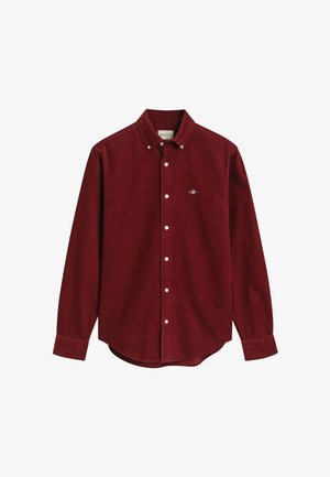 Herren Langarmhemd aus dunkelrotem Cord mit Knopfleiste, Kragen mit Knöpfen und kleinem gesticktem Logo auf der linken Brust.