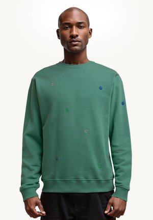 Felpa verde in cotone, con colletto rotondo, polsini a costine e accenti ricamati sparsi: cuori e simboli di pace in vari colori.