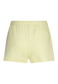 Yellow cotton shorts featuring an elastic waistband, short length, and one back pocket with a simple, seamless design.