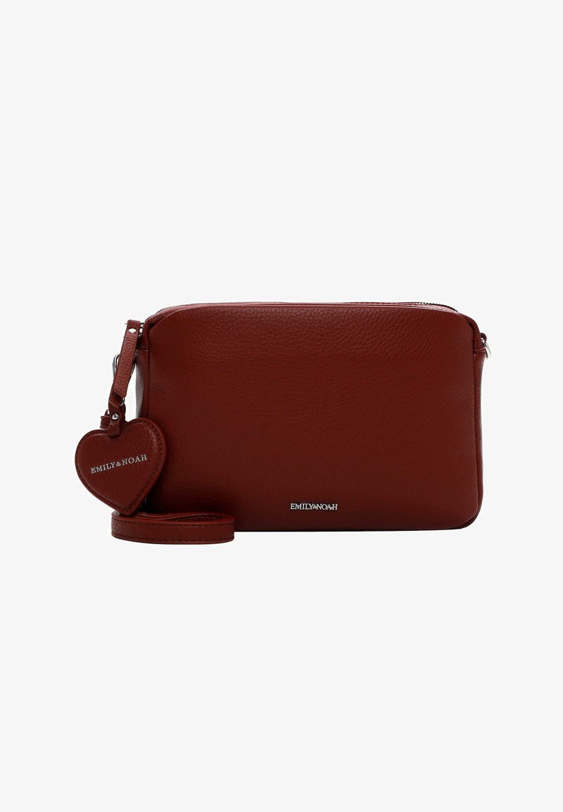 Red leather crossbody bag with a smooth texture, zip closure, and a detachable heart-shaped tag. Features a matching strap.
