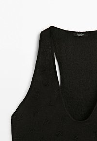 Black sleeveless dress with lace fabric and beaded floral patterns, featuring a deep rounded neckline and a Massimo Dutti label inside.