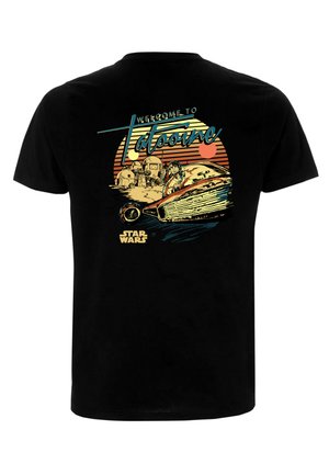 T-shirt en coton noir avec un imprimé graphique coloré représentant un speeder et une scène désertique, accompagné du texte « Bienvenue à Tatooine » et du logo Star Wars.