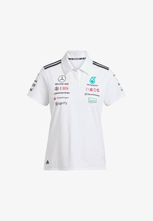 White polo shirt with short sleeves, three-button collar, featuring black stripes, various sponsor logos, and an Adidas logo at the hem.