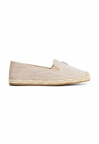 Beige canvas espadrilles met een gestructureerde afwerking, elastische zijpanelen en een jute-geweven zool. Kenmerkt zich door een klein logo op de bovenkant.