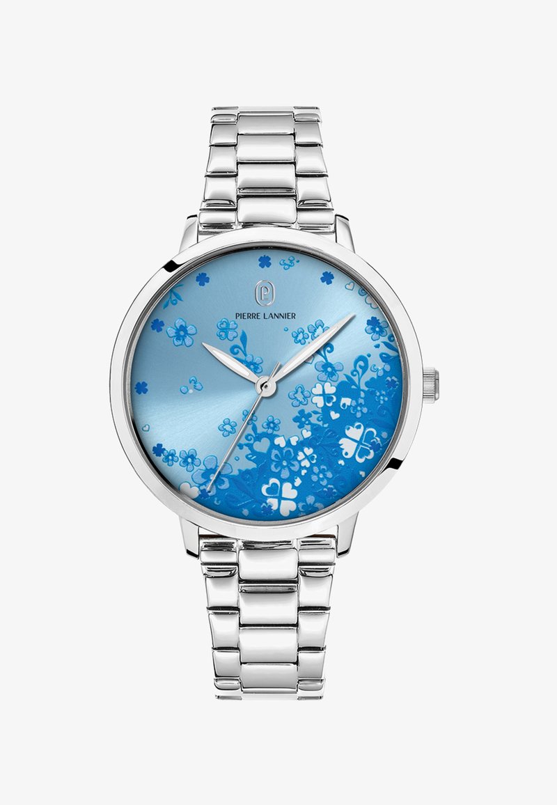 Sidabrinis nerūdijančio plieno laikrodis su apvaliu mėlynu gėlių raštuotu ciferblatu ir sidabro spalvos rodyklėmis. Pasižymi sujungtu metaliniu apyrankės dirželiu.