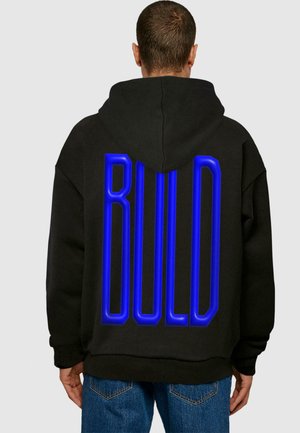 Black hooded sweatshirt with oversized fit. Features a prominent blue "BUILD" text display on the back. Soft fabric texture.
