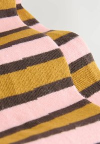 Knit garment featuring horizontal stripes in pink, brown, and mustard yellow. Soft texture with a clean finish around the edges.