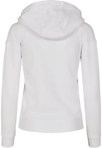 Vit huvtröja med en mjuk textur, med en stor huva och långa ärmar. Manschetterna och nederkanten är ribbade för en tät passform.