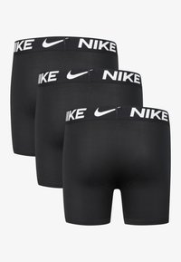 Črne boksarice v paketu treh, z belim elastičnim pasom z oznako "NIKE". Gladek material s prilegajočim dizajnom.