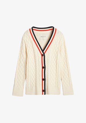 Villapaita, jossa on kerros- ja V-kaula-aukko, mustavalkoisilla raidoilla koristeltu reunus ja ruskeat napit edessä.