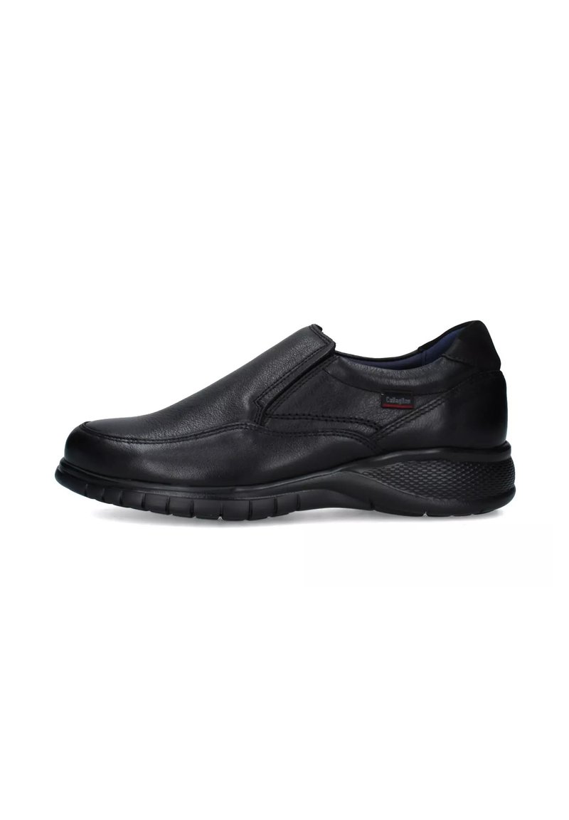 Scarpe slip-on in pelle nera con finitura liscia, pannelli laterali elasticizzati, suola ammortizzata e tacco testurizzato per aderenza e comfort.