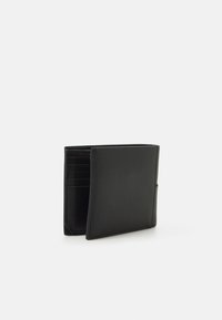 Black leather wallet with a slim design, featuring multiple card slots and a sleek finish, showcasing a smooth, matte texture.