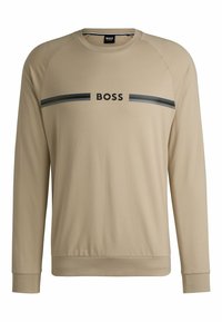Sweat-shirt beige à manches longues avec manches raglan. Présente un logo "BOSS" noir et des rayures sur la poitrine. Tissu doux avec une texture lisse.