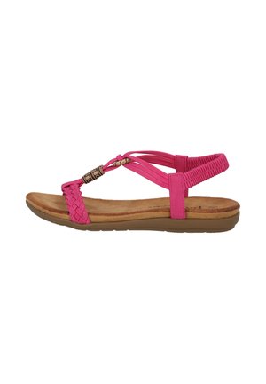 Pink flat sandal with woven straps, comfortable footbed, and rubber outsole. Features a decorative metal accent near the toe.