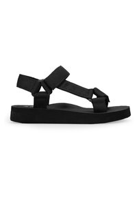 Sandalia negra con correas texturizadas y suela plana de diseño simple. La correa continua ofrece soporte adicional.