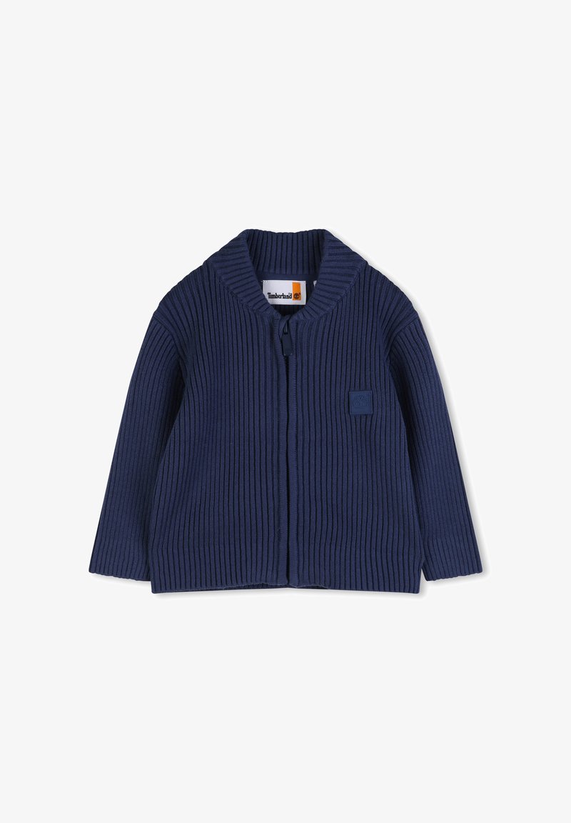 Pull en maille côtelée bleu marine avec col châle, fermeture éclair à l'avant et patch logo Timberland sur la poitrine. Comprend des manches longues et un tissu texturé.
