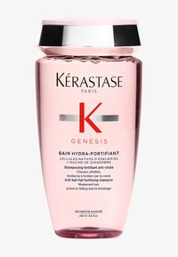 Champú hidratante Kérastase Genesis, botella rosa, tapa plateada, 250 ml. Texto en francés e inglés que destaca los beneficios anti-caída del cabello.