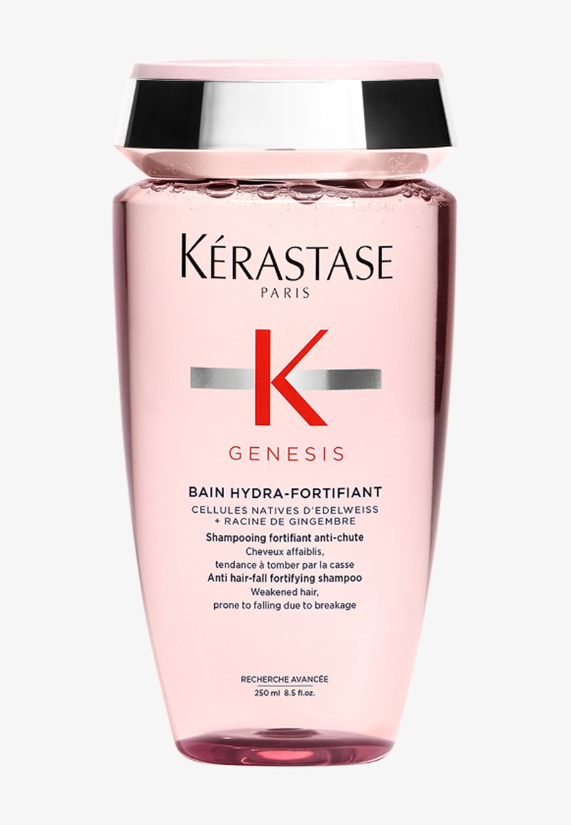 Champú hidratante Kérastase Genesis, botella rosa, tapa plateada, 250 ml. Texto en francés e inglés que destaca los beneficios anti-caída del cabello.