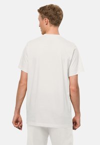 Weißes Baumwoll-T-Shirt mit kurzen Ärmeln, rundem Halsausschnitt und entspannter Passform. Die Rückansicht zeigt eine glatte Textur ohne sichtbare Logos oder Muster.