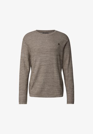 Svetr s dlouhým rukávem v světle hnědé barvě, vyrobený z texturované látky s jemným vzorem. Má kulatý výstřih a malou nášivku s logem.