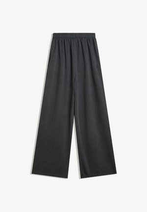 Pantalons larges noirs en tissu doux, avec une taille élastique et des poches latérales. Texture lisse sans motifs ni accents visibles.