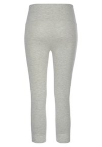Hellgraue Leggings aus einem weichen, dehnbaren Stoff. Mit hohem Bund und nahtlosem Design für zusätzlichen Komfort. Keine sichtbaren Befestigungen oder Muster.