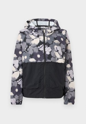 Gevoerde jas met ritssluiting, zwart aan de onderkant en grijs met bloemenpatroon op het bovenste deel en de mouwen, met het Columbia-logo op de borst.