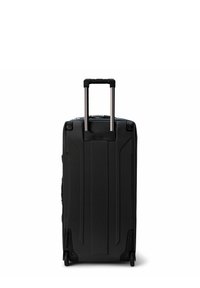 Black hard-shell suitcase with a textured surface, extending metal handle, and four wheels for easy mobility. Features streamlined design and sturdy construction.