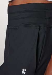 Sweaty Betty GAIA YOGA PANTS - Παντελόνι φόρμας - black