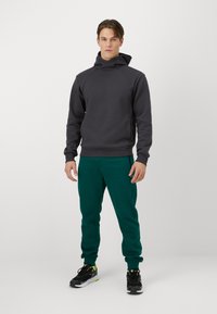 Champion ICONS CUFF PANTS - Treniņtērpa apakšdaļas - green