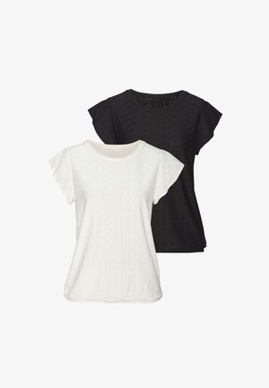 Twee t-shirts met korte mouwen, één wit en één zwart, met een textuurpatroon van kleine diamantvormige uitsparingen en een ronde halslijn.