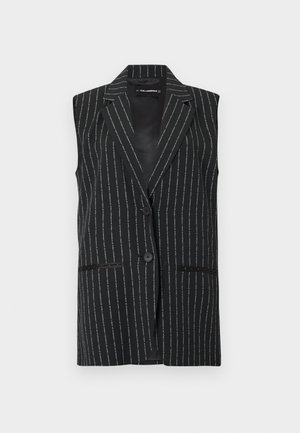 Blazer noir sans manches avec un motif à fines rayures blanches et deux boutons à l'avant, doté de revers crantés et de deux poches avant.