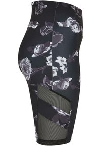 Sorte blomstrete tights med høy livlinje, mesh-detaljer på sidene og en tettsittende design for komfort og fleksibilitet.