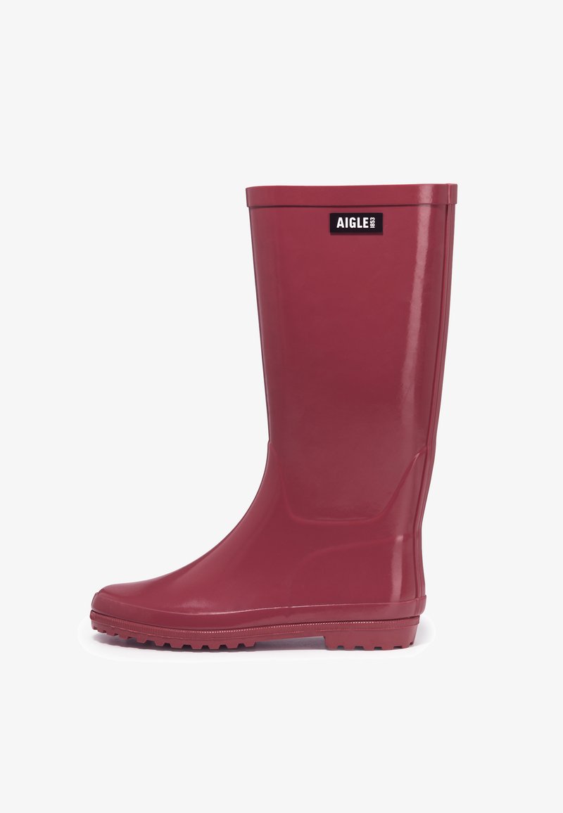 Red waterproof rubber rain boot with a smooth, glossy finish, rounded toe, textured sole, and "AIGLE" logo on the upper front.