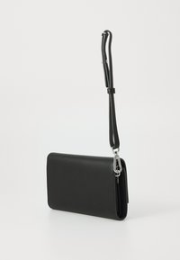 Black leather clutch with a slim, rectangular shape. Features a detachable strap and silver hardware for closure and attachment.