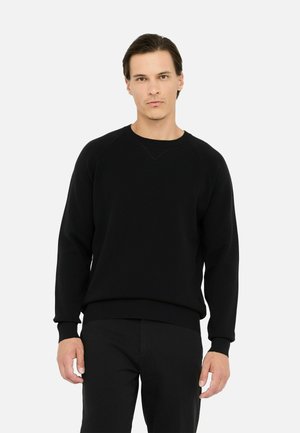 Felpa nera realizzata in materiale morbido, con maniche raglan, colletto rotondo e polsini e orlo a costine. Nessun logo o motivo visibile.