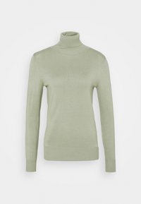 Pull à col roulé vert clair en tissu doux. Il présente des manches longues, une coupe ajustée, ainsi que des poignets et un ourlet côtelés.