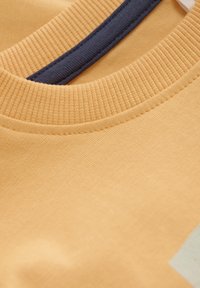 Minymo T-shirt med print - mock orange