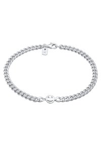 Silverfärgad kedjebracelet med sammanlänkade länkar, en liten smiley face-charms och en kräftklolås. Slät, reflekterande finish.
