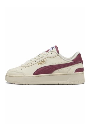 White leather sneaker with a maroon accent stripe, featuring a textured rubber sole, lace-up front, and embossed logo detail on the side.