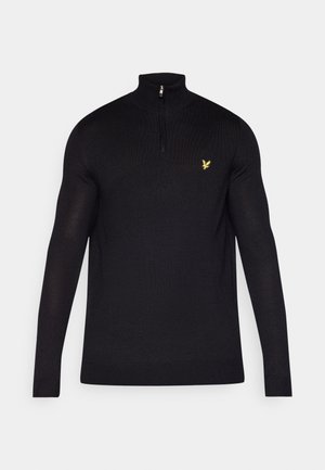 Sort zip-up sweater lavet af glat stof, med høj krave og lange ærmer. Lille gult logo på venstre brystområde.