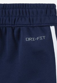 Nike Sportswear CLUB PROPUS UNISEX SET - Pantaloni de trening - midnight navy