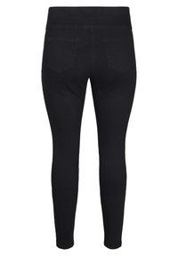 Jeans ajustados negros con una cintura alta, que presentan dos bolsillos traseros y una tela de denim suave y elástica.