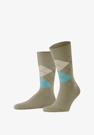 Calze in misto cotone verde con motivo argyle in beige chiaro, blu e verde. Caviglia a costine e texture liscia.