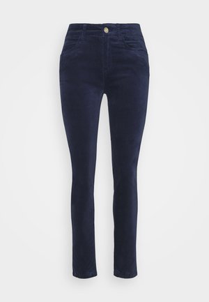 Navy corduroy trousers with a fitted design, front pockets, and golden button detail at the waist. Smooth texture and straight leg cut.