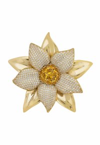 Gold and silver brooch shaped like a flower, featuring a textured gold center with yellow stones and encrusted white stones on the petals.