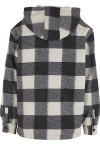 Camicia di flanella con cappuccio in un motivo a quadri grigi e neri, caratterizzata da una consistenza morbida e polsini con bottoni. Vista posteriore visibile.